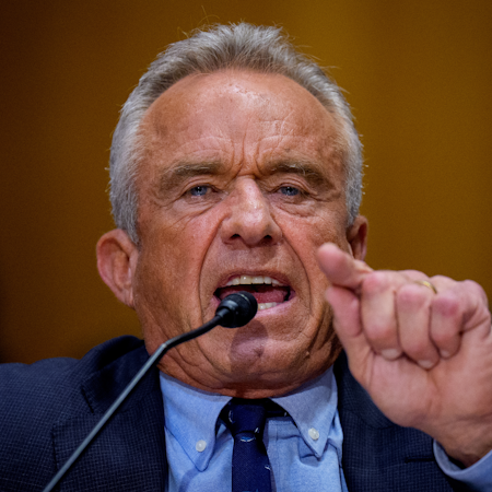 Health Secretary Robert F. Kennedy Jr. pointing and talking into a microphone.