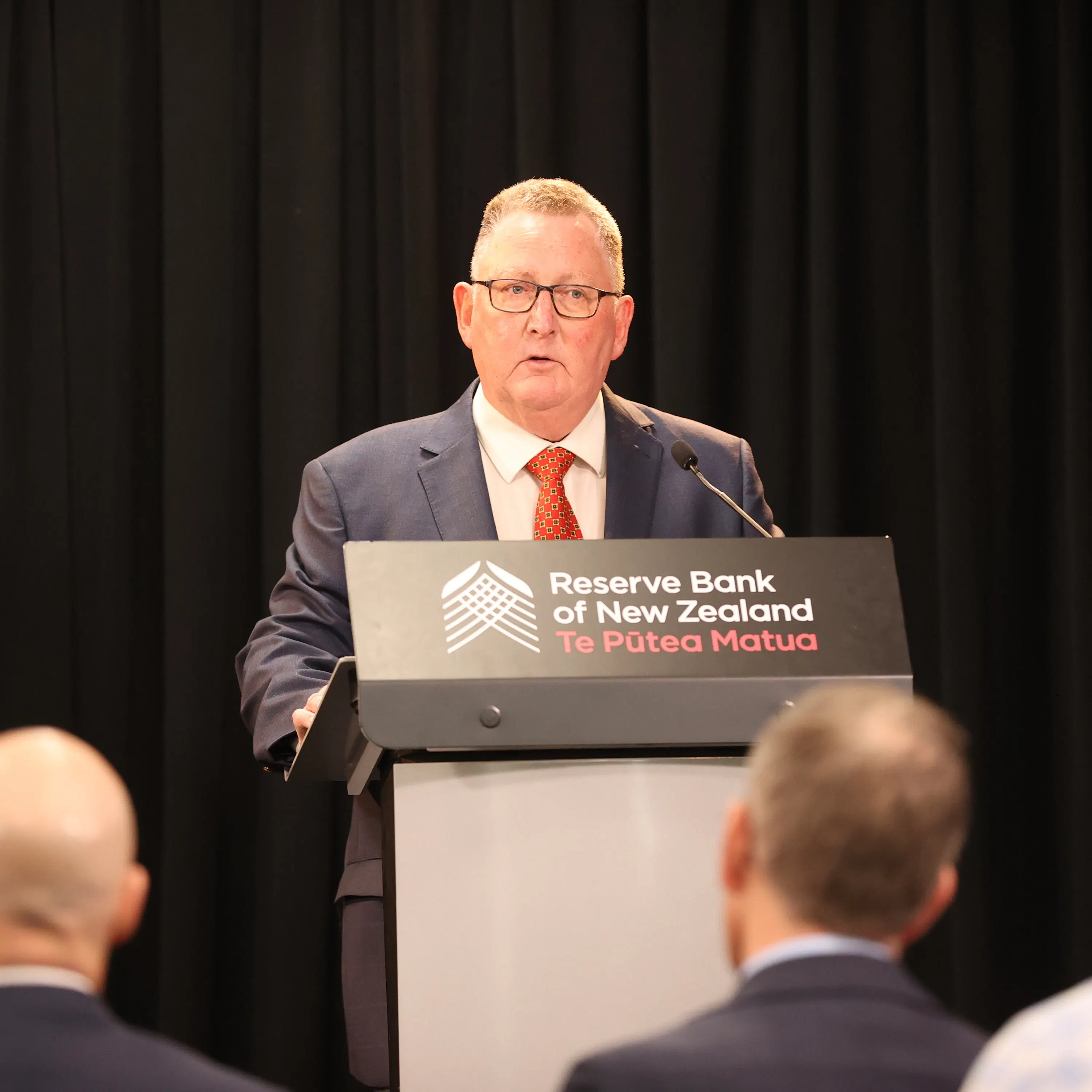Reserve Bank Governor Adrian Orr speaks after cutting the OCR episode artwork