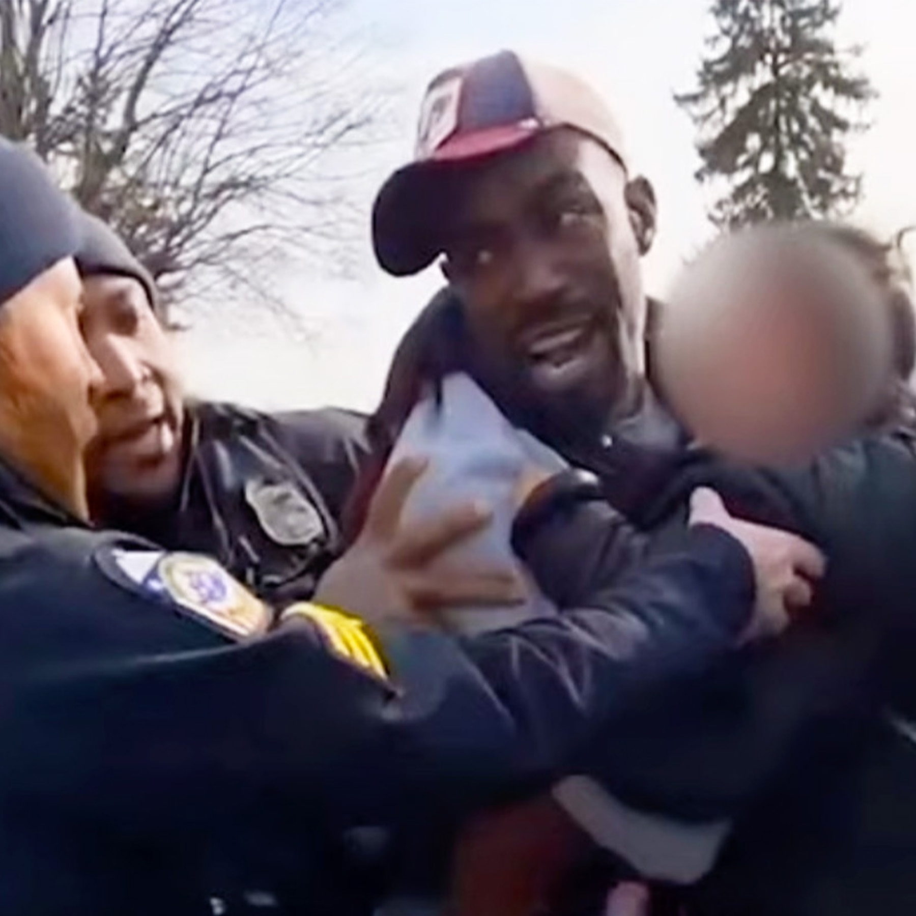 Cop Doesn't Care That He's Holding a Baby